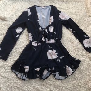 Floral boutique romper size medium worn once